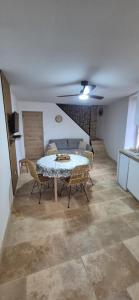 a dining room with a table and chairs in a room at Le Donjon du Chateau in Tournissan +7 photos