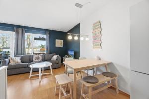 a living room with a table and a couch at Fewo Henri in Zempin