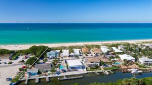 an aerial view of a beach with houses and a dock at A Beach Retreat on Casey Key in Venice