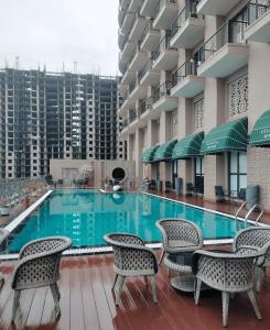a swimming pool in the middle of a building at Singh Royal stay in Lucknow