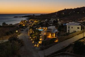 a view of a town at night with the ocean at Relax Joy Villa | Koundouros Kea Beachside in Koundouros