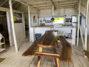 a wooden table and chairs in a kitchen at Casa de los Artistas in Marbella