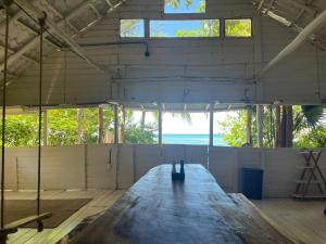 a large room with a wooden floor and windows at Casa de los Artistas in Marbella