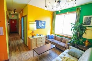 a living room with a couch and a table at Hostel Detroit in Detroit +38 photos