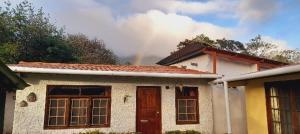 a rainbow in the sky above a house at Cabañas DondeJosé in Valle de Anton +56 photos