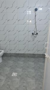 a bathroom with a shower and a toilet at MH Zanzibar in Jambiani +21 photos