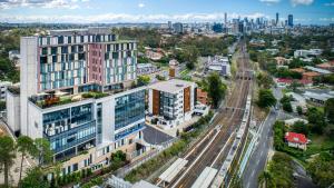 an aerial view of a city with buildings at Essence Suites Taringa in Brisbane