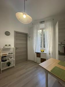 a kitchen with a table and a dining room at Casa Di Francesco in Velletri