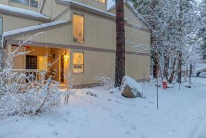 a building with snow on the ground in front of it at 3BD Three Minutes from King Beach in Kings Beach