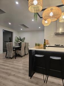 a kitchen and dining room with a table and chairs at Pakawau Princess in Pakawau