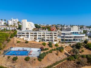 an aerial view of a building with a swimming pool at Ocean View - XL Terrace - Beachfront by Tenório in Lagos