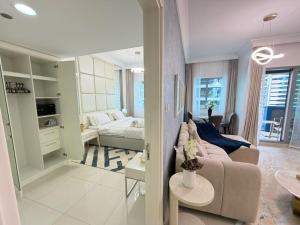 a living room with a couch and a table at Damac mall street in Dubai