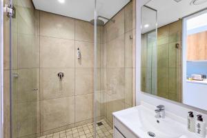 a bathroom with a shower and a sink at Ellipse Soleya in Midrand +33 photos