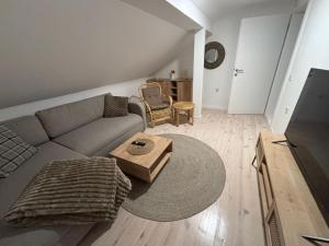 a living room with a couch and a table at Duplex House - Private Home MUNA in Sarajevo