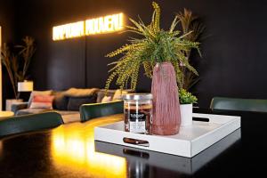 a table with a vase sitting on top of it at Indy Getaway - Near Downtown Indy - Sleeps 10! in Indianapolis
