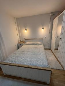 a bedroom with a large bed in a room at Duplex House - Private Home MUNA in Sarajevo