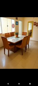a dining room with a table and chairs at casas praias familiar in Piçarras