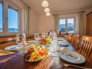 a dining room table with fruits and wine glasses at Pehambauer S in Hüttau +22 photos