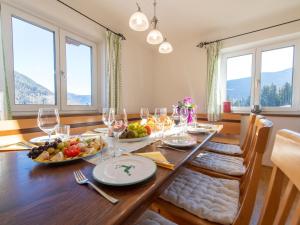 a dining room with a table with fruits and wine glasses at Pehambauer S in Hüttau