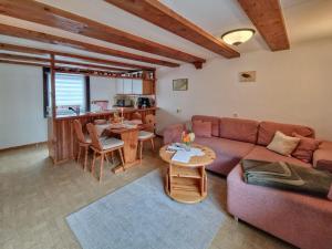 a living room with a couch and a table at Neubert in Breitenbrunn