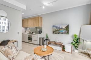 a living room with a couch and a table at The Solace in Midrand