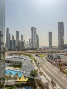 a view of a city with a highway and buildings at Central Park towers residence difc in Dubai