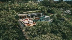 an overhead view of a house in the trees at Bio Habitat Hotel, AKEN SOUL Collection in Armenia