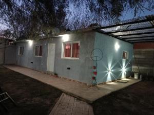 a house with a basketball hoop on the side of it at Los Colibríes del Valle in Valle Hermoso
