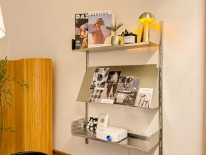 a shelf in a room with photos and a lamp at Sinnonhyeon Station 5minutes, Gangnam Plastic Surgery, Severance Hospital, COEX, airport bus 5minutes, Hongdae 30minutes, Itaewon 15minutes, 명동 30minutes in Seoul +37 photos