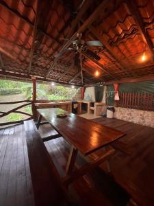 a wooden table in the middle of a room at Cocles House in Talamanca