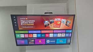 a television screen with a bunch of apps on it at Flat Pampulha orla prox Mineirão com varanda in Belo Horizonte