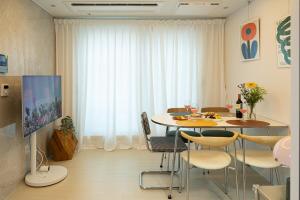 a dining room with a table and chairs at ABC Stay in Seoul