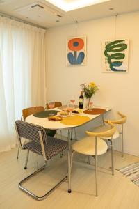 a dining room with a table and chairs at ABC Stay in Seoul