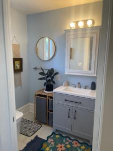 a bathroom with a sink and a mirror at Suite in Downtown Riverside in Riverside +26 photos