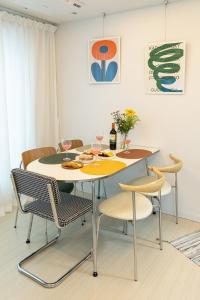 a dining room with a table and chairs at ABC Stay in Seoul