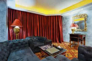 a living room with a couch and a piano at ABC Entertainment Resort in Angeles