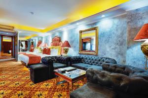 a living room with a couch and a bed at ABC Entertainment Resort in Angeles