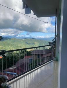 a balcony with a view of a mountain at Harmony Mines in Baguio