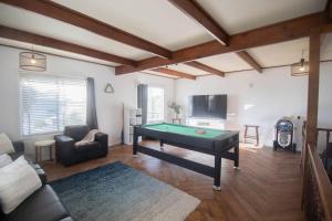 a living room with a pool table in it at Buninyong Golfside Getaway in Buninyong