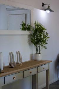 a bathroom counter with a sink and a mirror at Buninyong Golfside Getaway in Buninyong +30 photos