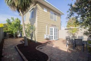 a house with a table and chairs in front of it at Buninyong Golfside Getaway in Buninyong
