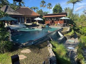 a swimming pool in the backyard of a house at Heaven in Bali in Penginyahan