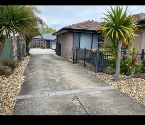 a walkway in front of a house with palm trees at Eureka Gold Stays 2 bedrooms 2 bathrooms Wendouree, Ballarat No pets in Wendouree