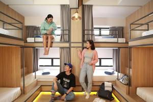 a group of people in a room with bunk beds at Lub d Manila Makati - Central Makati, Near Nightlife in Manila