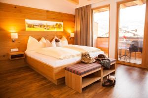 Postel nebo postele na pokoji v ubytování Hotel Post