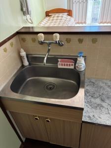 a sink in a kitchen with a counter at アルピエj107号室無料Wi-Fiあり熊本城徒歩5分 in Kami-kumamoto +10 photos
