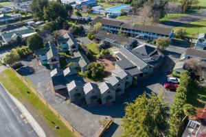 an aerial view of a residential neighbourhood with houses at Smoke Lake Hot Springs Lodge & Camp in Rotorua