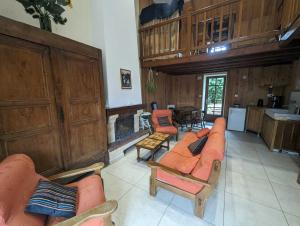 a large living room with couches and a fireplace at Relais de la vallée de l'ource in Villars-Montroyer +23 photos