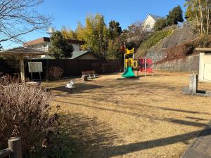 a playground in a yard with at アルピエe207号室 軽自動車のみ敷地内無料駐車場Wi-Fi付き in Kumamoto