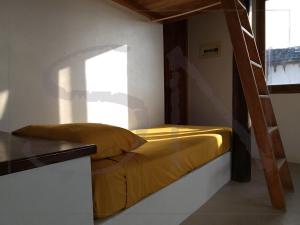 a bedroom with a bunk bed and a window at Seaside Nord in Máncora +12 photos